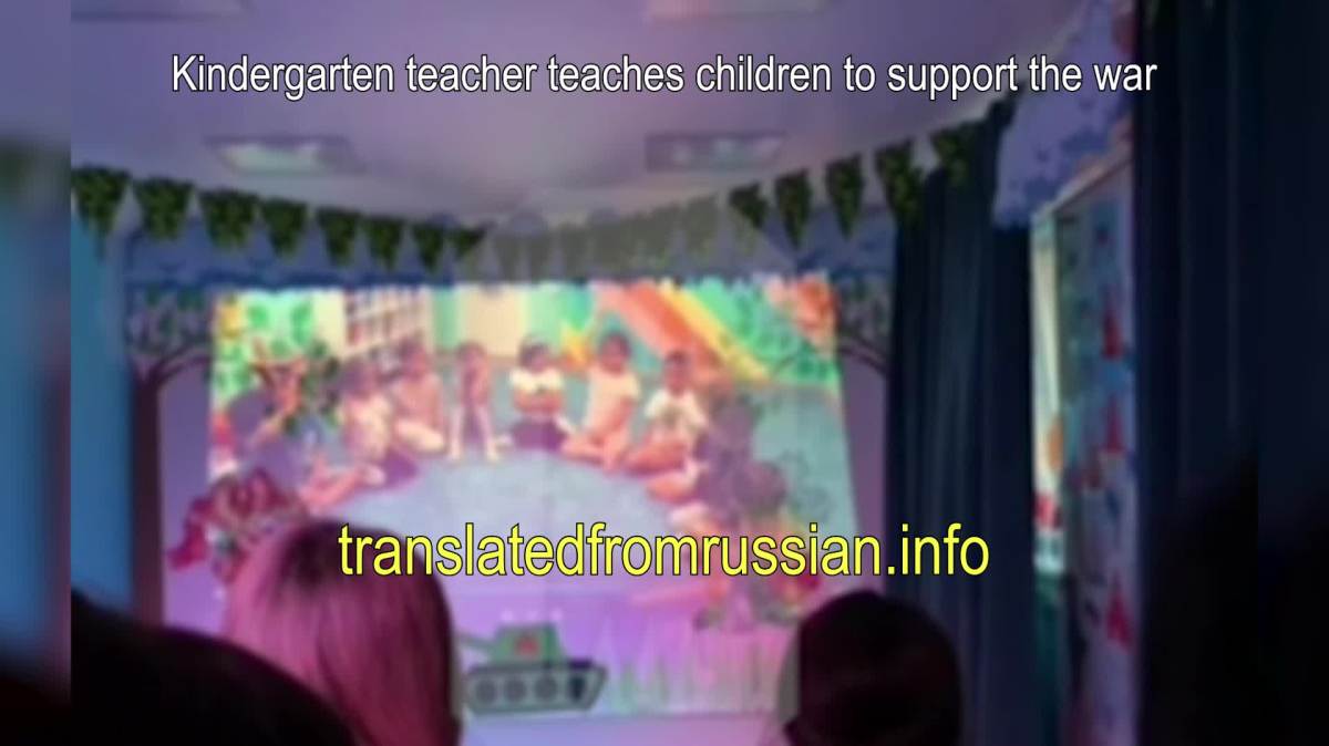 Kindergarten teacher teaches children to support the war