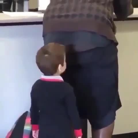 Child stares into man's butt